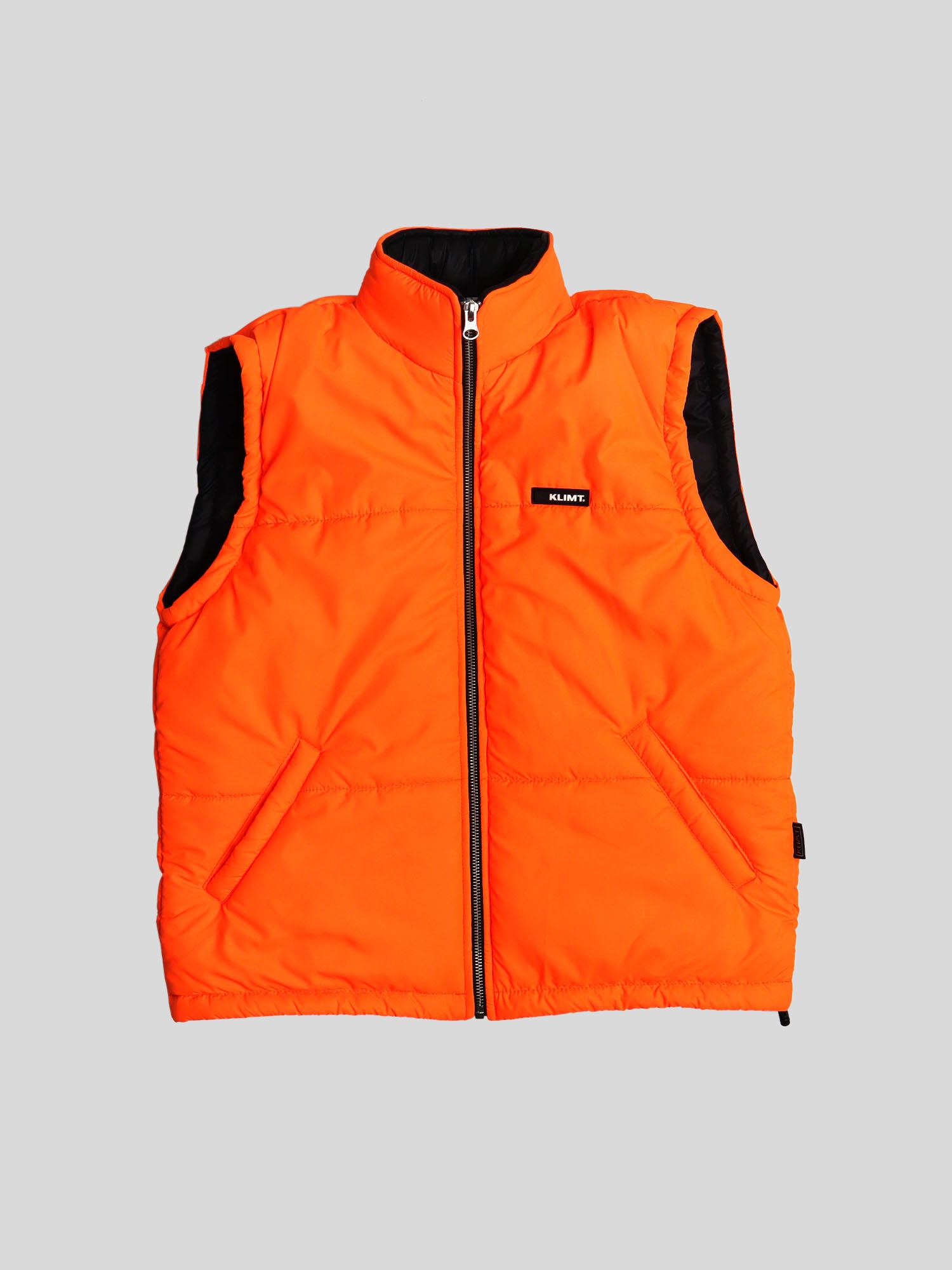 Orange sleeveless puffer jacket hotsell